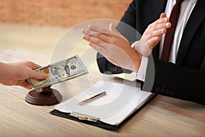 Judge refusing to take bribe. Corruption concept