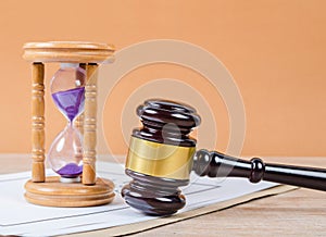 Judge`s gavel with hourglass on the table