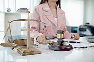 judge gavel in law office is placed on table to symbolize judge deciding lawsuit. gavel wood on wooden table of lawyers in lega photo