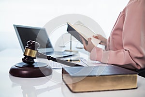 judge gavel in law office is placed on table to symbolize judge deciding lawsuit. gavel wood on wooden table of lawyers in lega photo