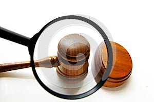 Judge's gavel and magnifying glass