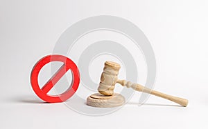 Judge`s gavel and NO symbol. The concept of prohibiting and restrictive laws. Prohibitions and criminalization, repression