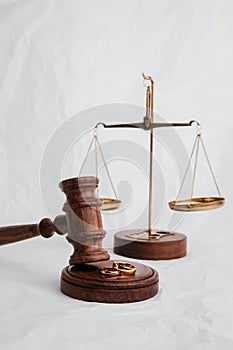 Judge's gavel with rings and scales. Vertical image