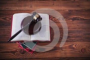 Judge`s gavel on top of stack of books