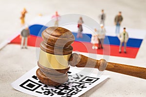 Judge`s hammer, barcode, Russian flag and plastic toy men