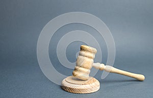 Judge`s hammer on a gray background. The judicial system. Norms, rules and laws. Conflict resolution in court. Court case