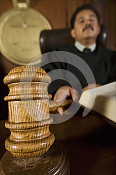 Judge Using Gavel In Courtroom