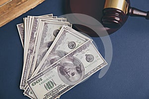 Judge wooden gavel with dollar money banknote concept for