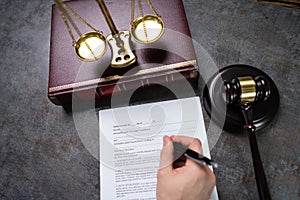 Judge Writing On Paper