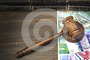 Judges Or Auctioneers Gavel, Dollars, Euro, Pounds On Wood Table