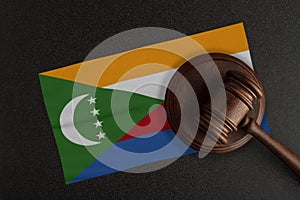 Judges gavel and the flag of Comoros. Law and Justice. Constitutional law