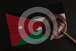 Judges gavel and the flag of Jordan. Law and Justice. Constitutional law