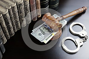 Judges Gavel, Handcuffs, Dollar Cash And Book On Black Table