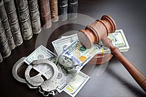 Judges Gavel, Handcuffs, Dollar Cash And Book On Black Table