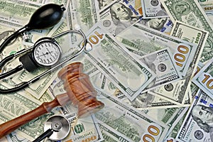 Judges Gavel And Medical Tools On Dollar Cash Background