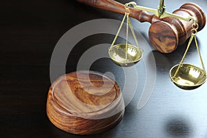 Judges Gavel And Scale Of Justice On The Black Table