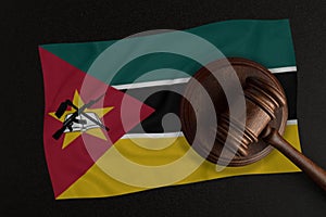 Judges hammer and the flag of Mozambique. Law and Justice. Constitutional law
