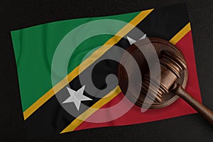 Judges hammer and the flag of Saint Kitts and Nevis. Law and Justice. Constitutional law