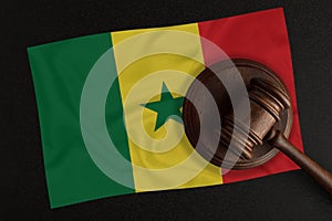 Judges hammer and the flag of Senegal. Law and Justice. Constitutional law