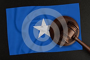 Judges hammer and the flag of Somalia. Law and Justice. Constitutional law