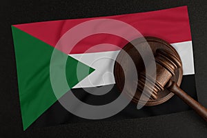 Judges hammer and the flag of Sudan. Law and Justice. Constitutional law