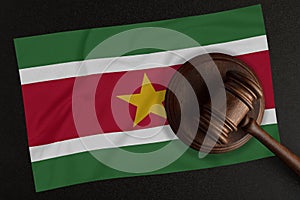 Judges hammer and the flag of Suriname. Law and Justice. Constitutional law