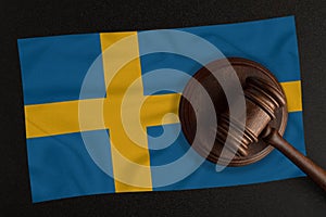 Judges hammer and the flag of Sweden. Law and Justice. Constitutional law