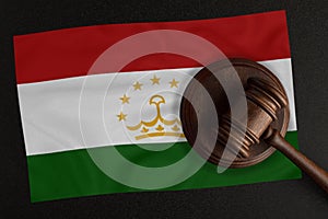 Judges hammer and the flag of Tajikistan. Law and Justice. Constitutional law