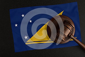 Judges hammer and the flag of Tokelau. Law and Justice. Constitutional law