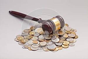 Judges law gavel on pile of coins