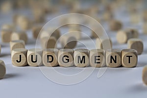 Judgment - cube with letters, sign with wooden cubes