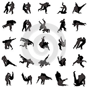 Judo wrestlers silhouette set icons, simple style