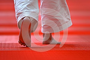 Judoka s precise footwork in summer olympics sport, highlighting balance and skill photo