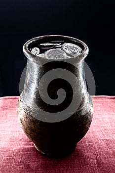 Jug with coins