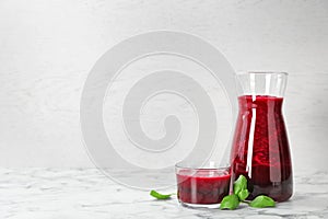 Jug and glass of fresh beet juice