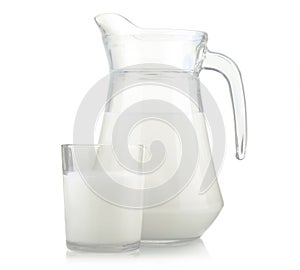 Jug and glass of milk isolated