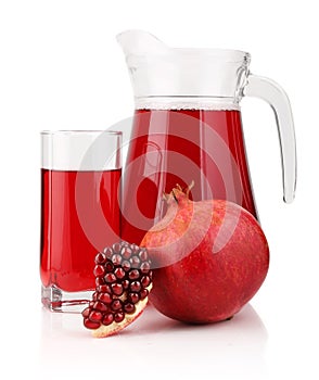 Jug and glass of pomegranate juice and fruits