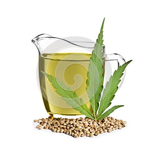 Jug with hemp oil, leaf and seeds