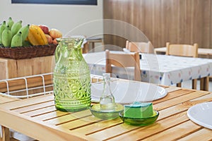 Jug made of glass on washing sink in Montessori for kid learning