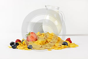 Jug of milk and corn flakes with fruits