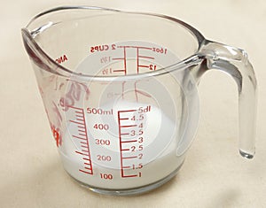 Jug of milk used in cooking photo