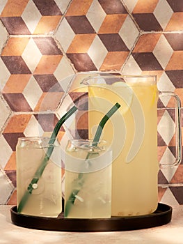 A jug and two glasses of Elderflower cordial