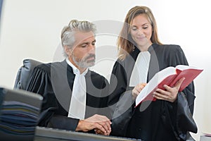 Juges with books on table