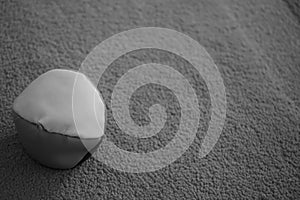 Juggle ball on grey carpet black and white photo