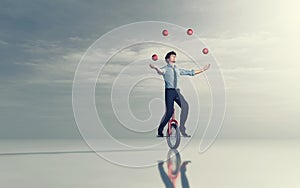 Juggling on unicycle