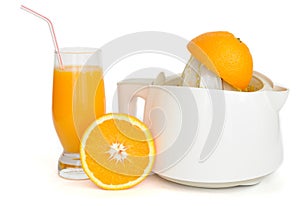 Juice extractor with a glass of orange juice photo