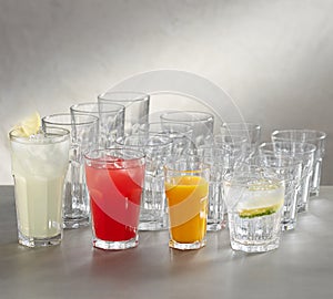 Juice glasses - empty, red juice , white juice and rose juice . photo