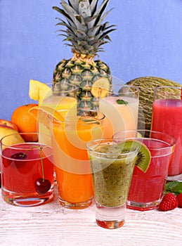 Juice with kiwi, banana, cherry, melon, tangerine, pear