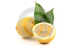 Juice lemons with green leaves