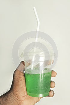 juice in plastic cup with straw